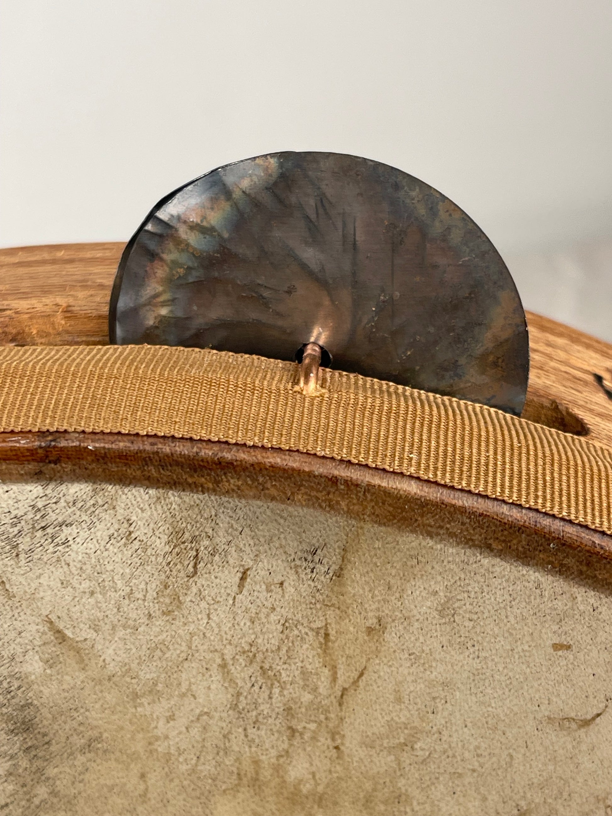 Charred and hand-hammered tin jingles typical of Calabrian tambourine tradition