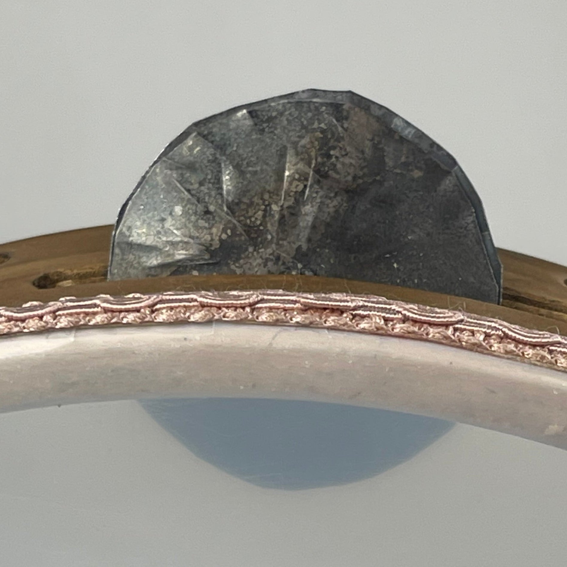 Close-up of 6.5 cm fire-treated jingles on traditional tamburello