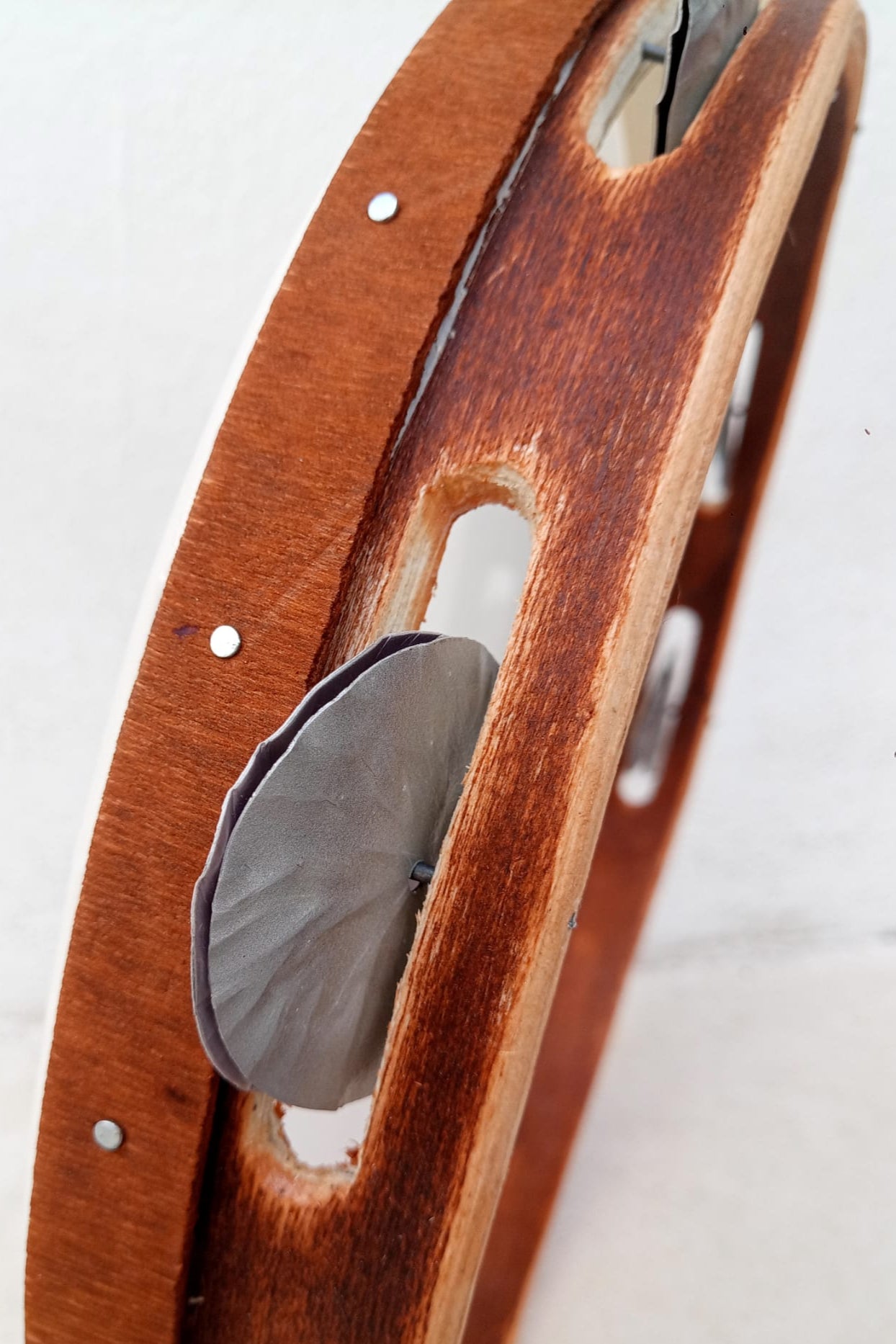 Close-up of 6 cm jingles on Mylar tamburello