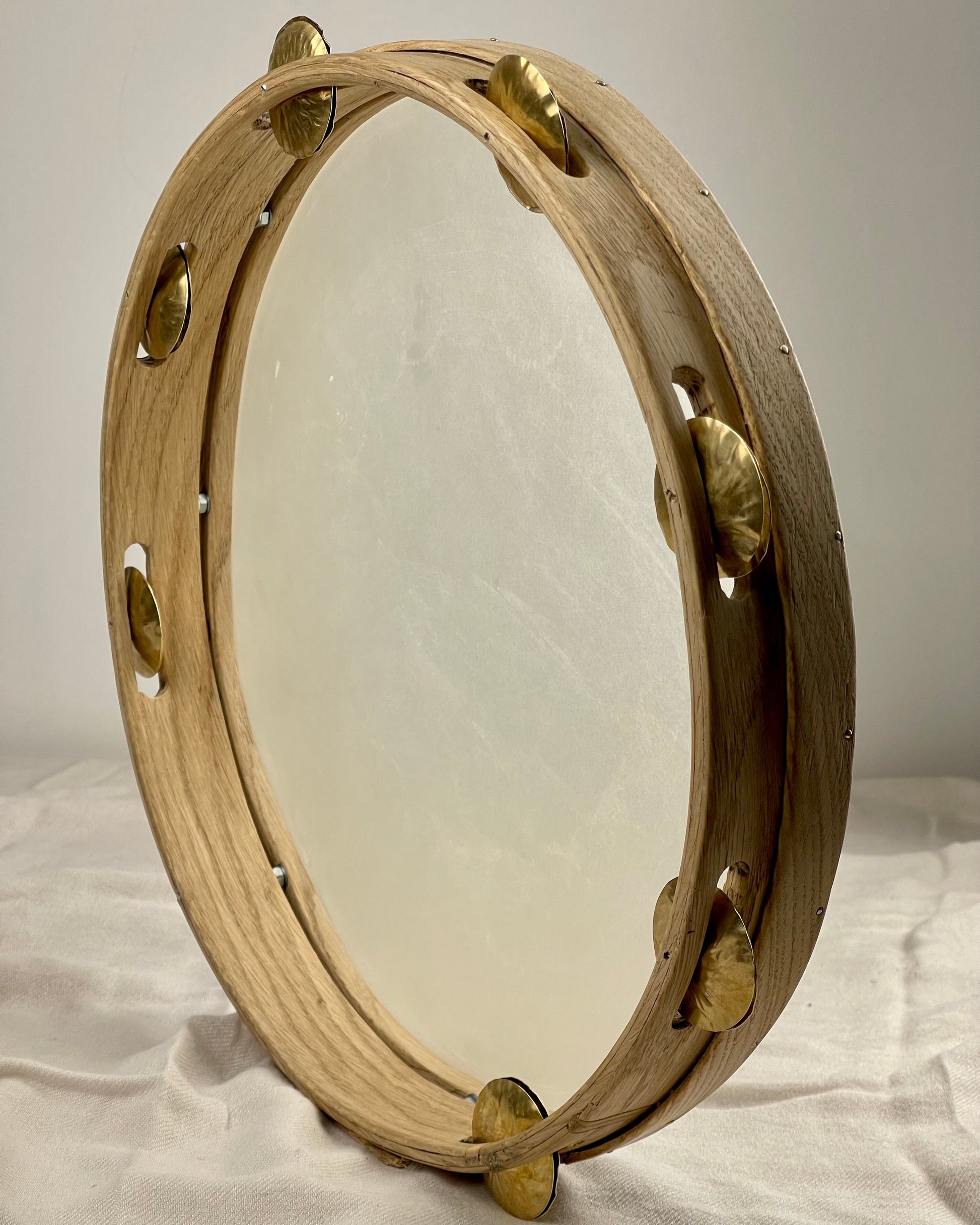 Close-up of brass jingles and traditional frame shape