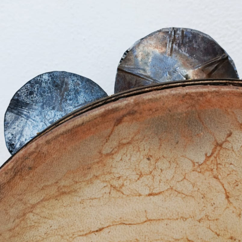 Close-up of double-row tin jingles on traditional tambourine