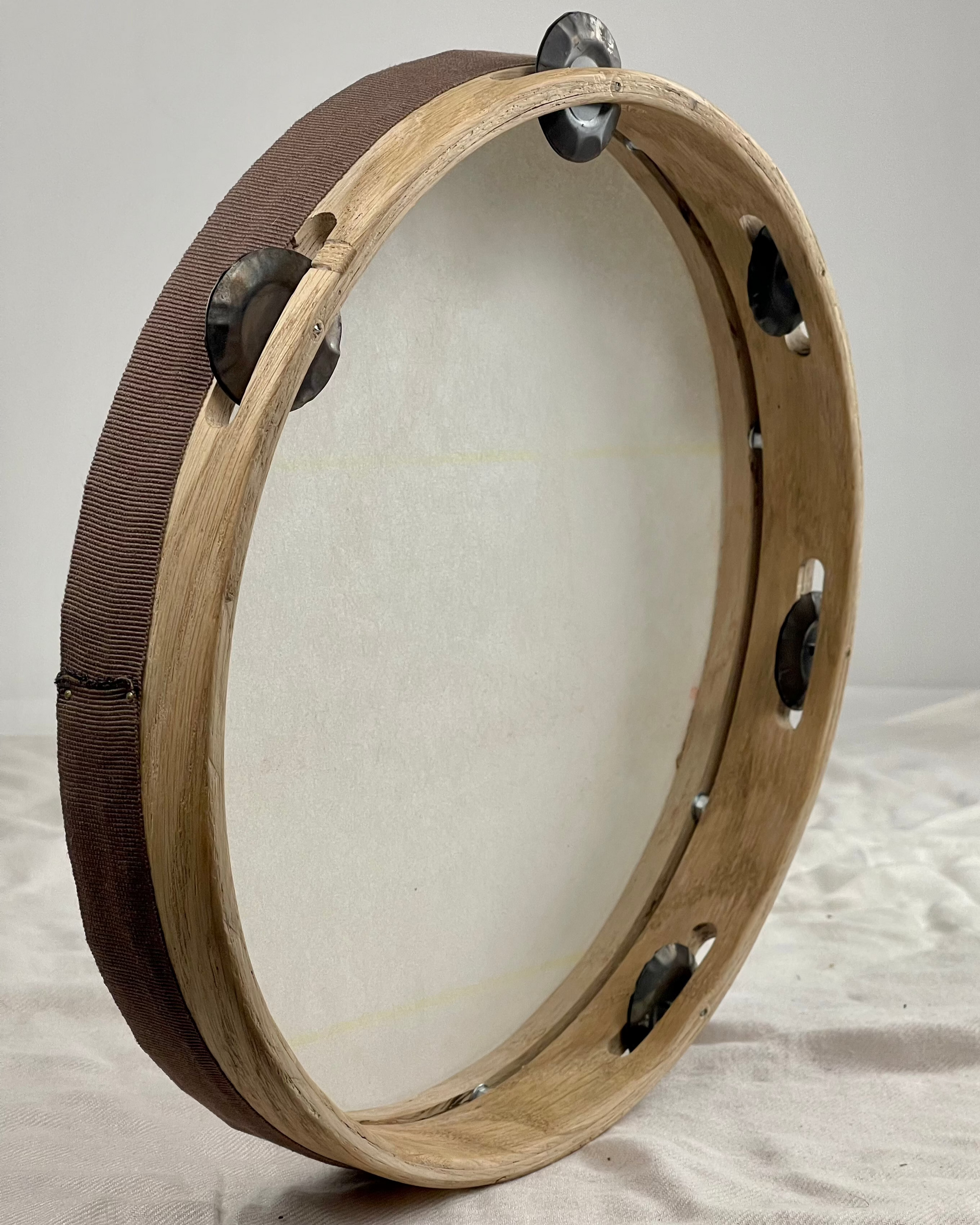 Detail of hand-hammered 4 cm jingles on NAVIZCA tambourine