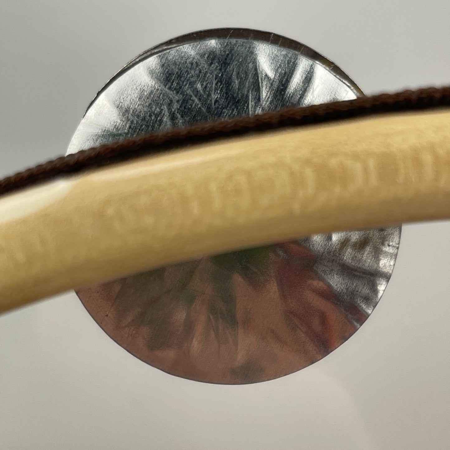 Detail of transparent head and jingles on Fruscio tamburello