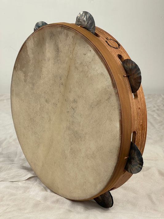 Front view of 30 cm traditional Calabrian tambourine with red goatskin head and tin jingles