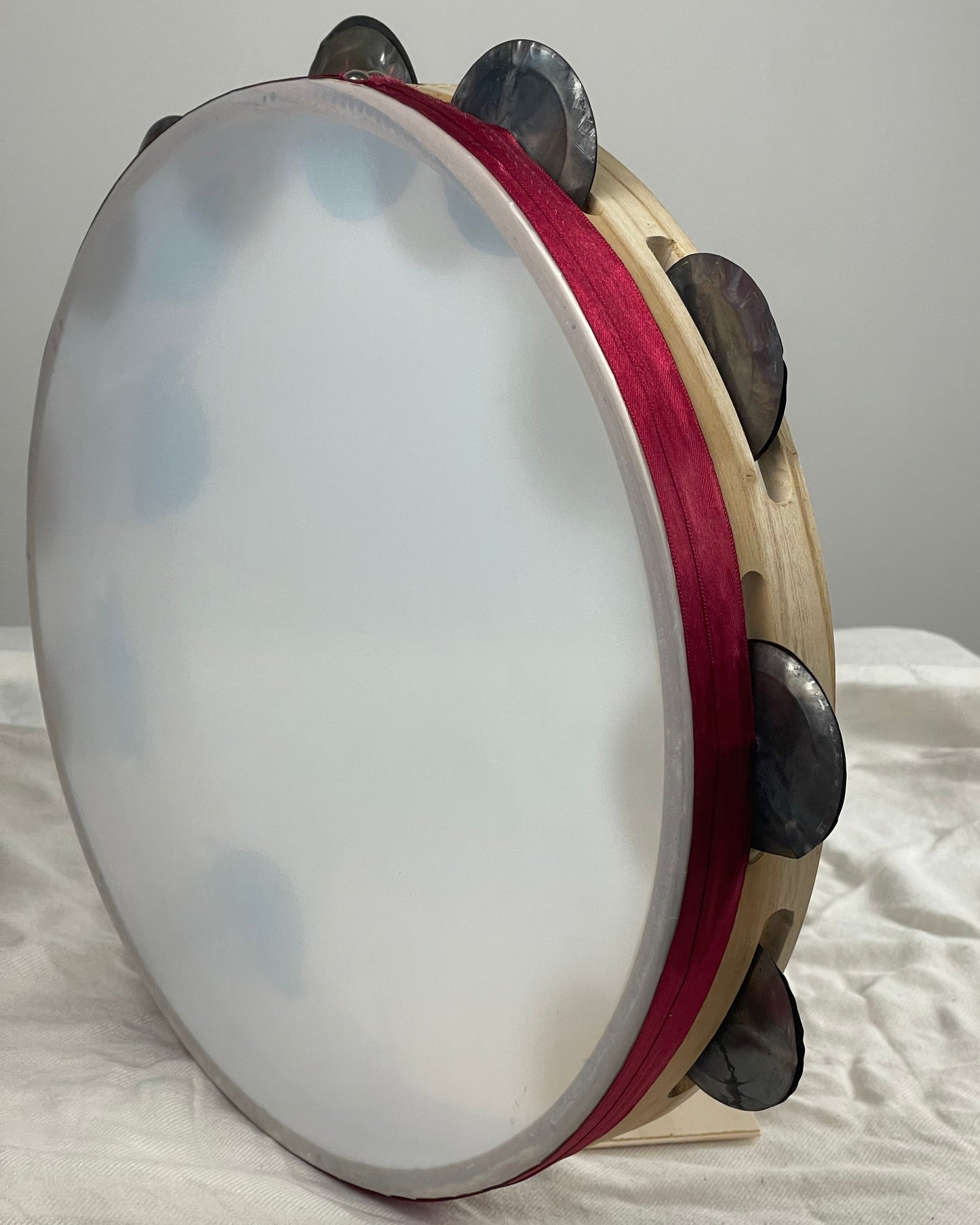 Hand-hammered jingles – semi-transparent tambourine