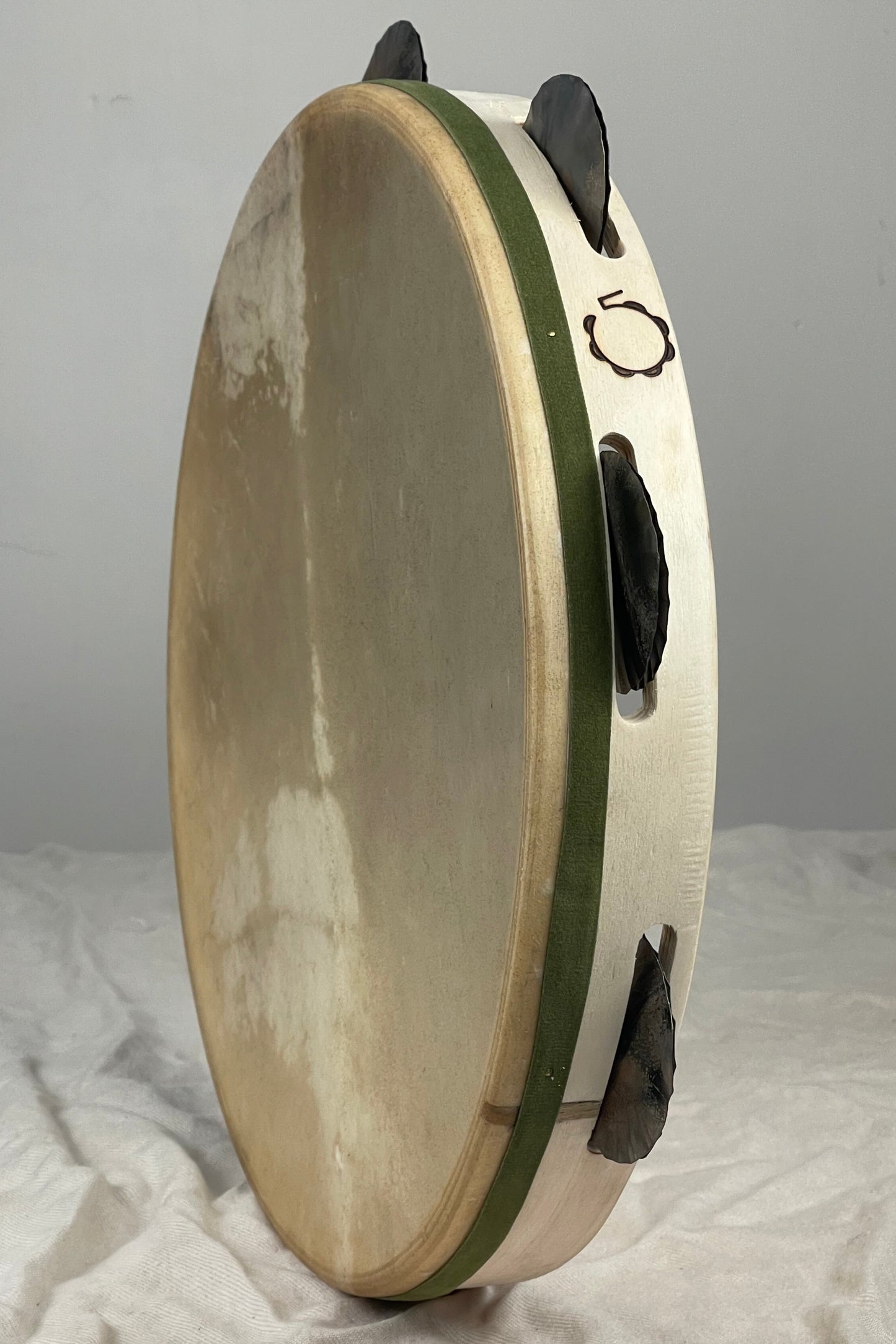 Hand-hammered tin jingles on beech tambourine frame