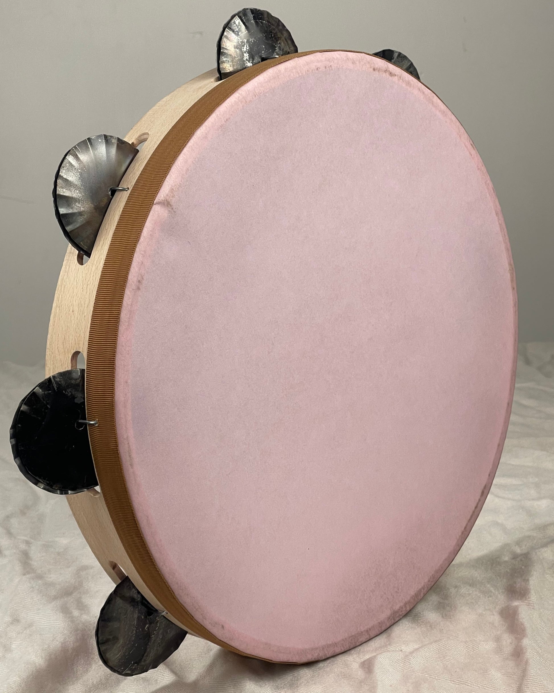 Pink tambourine with beechwood frame – front view