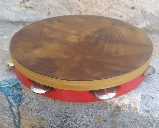 Red tamburello with black goatskin head and steel jingles