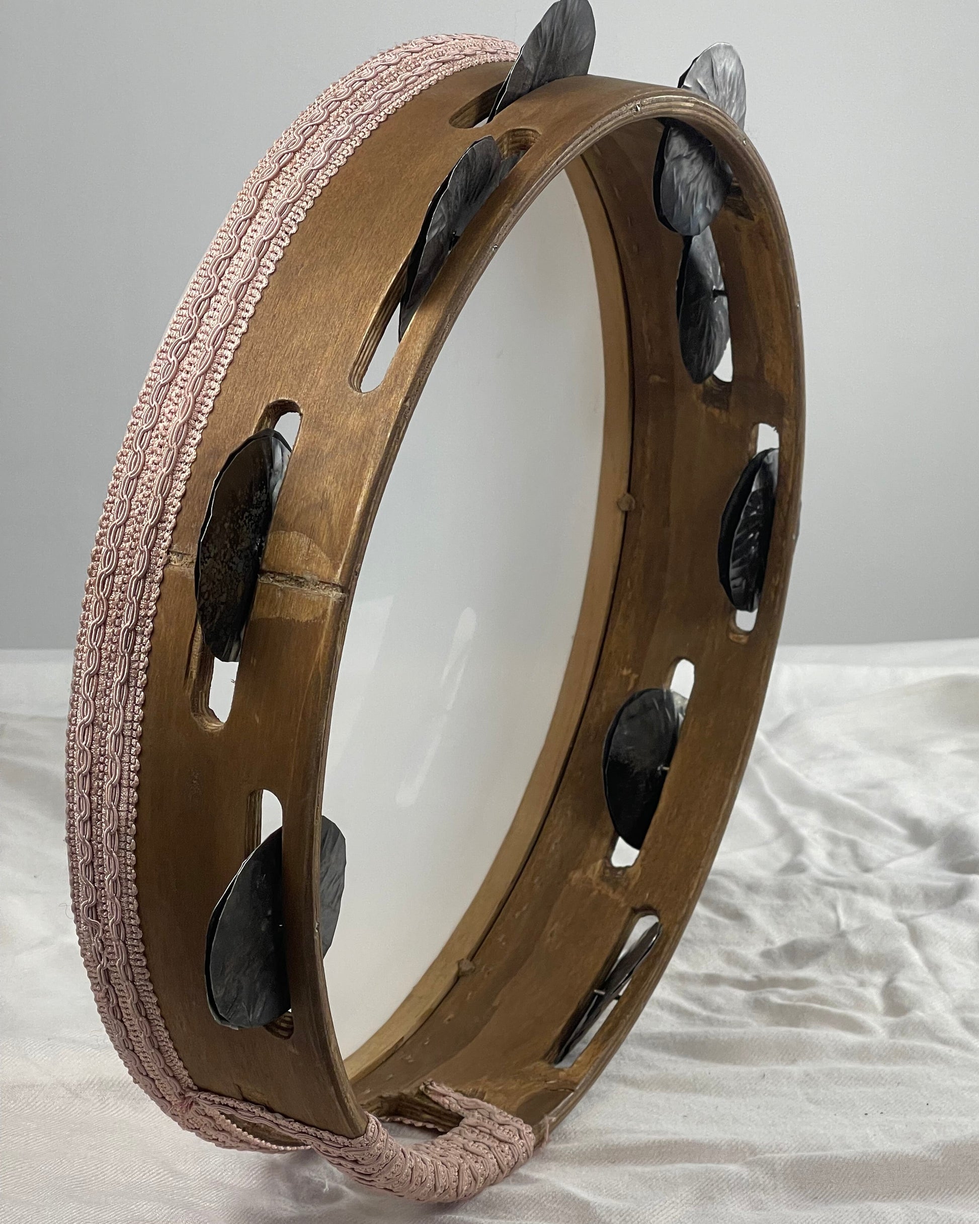 Side view of 8 cm deep walnut tamburello with grip window