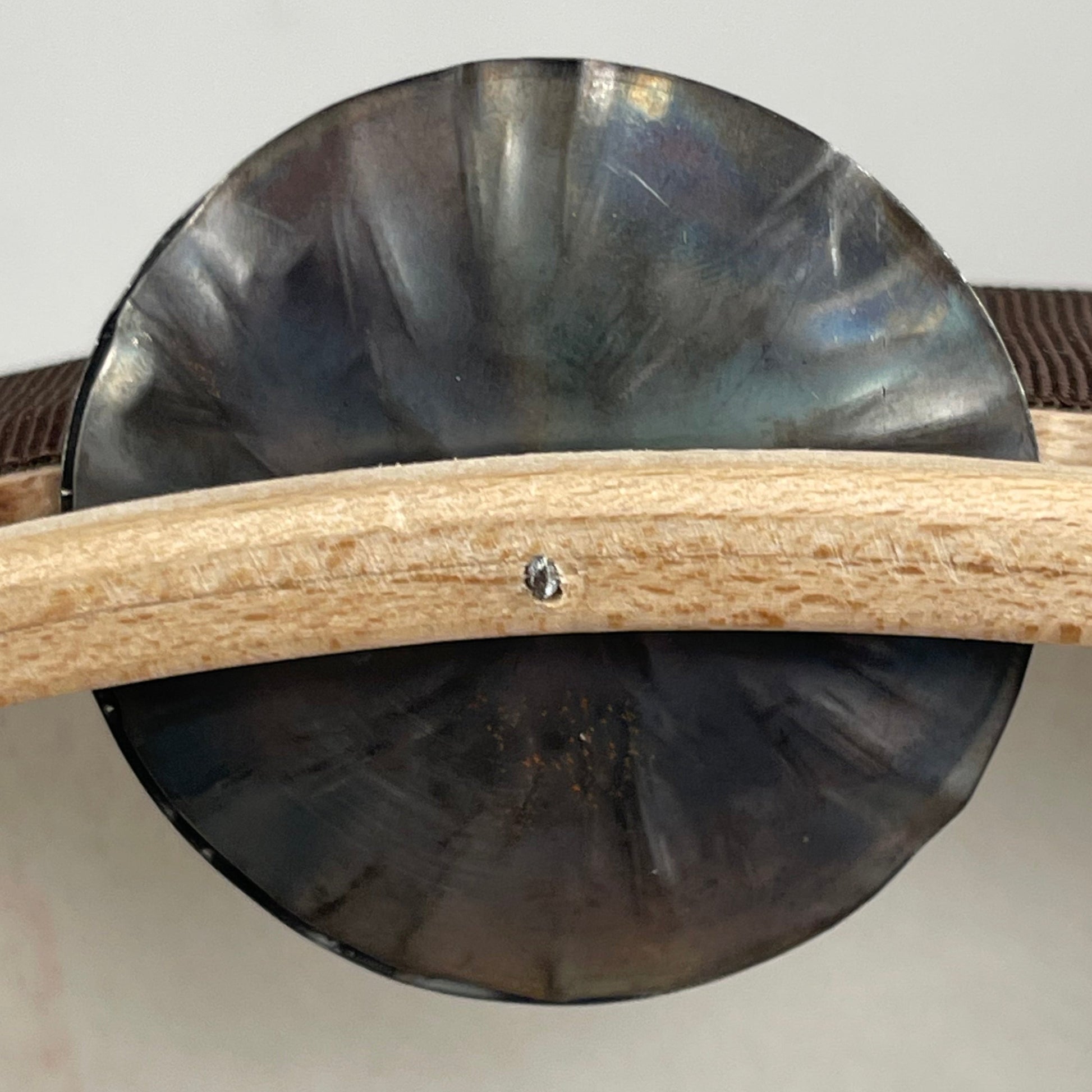 Side view of Luce tamburello showing tuning bolts and shallow fram