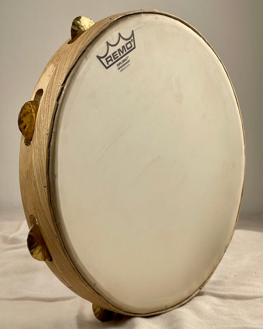 Side view showing rounded oak profile and tuning bolts