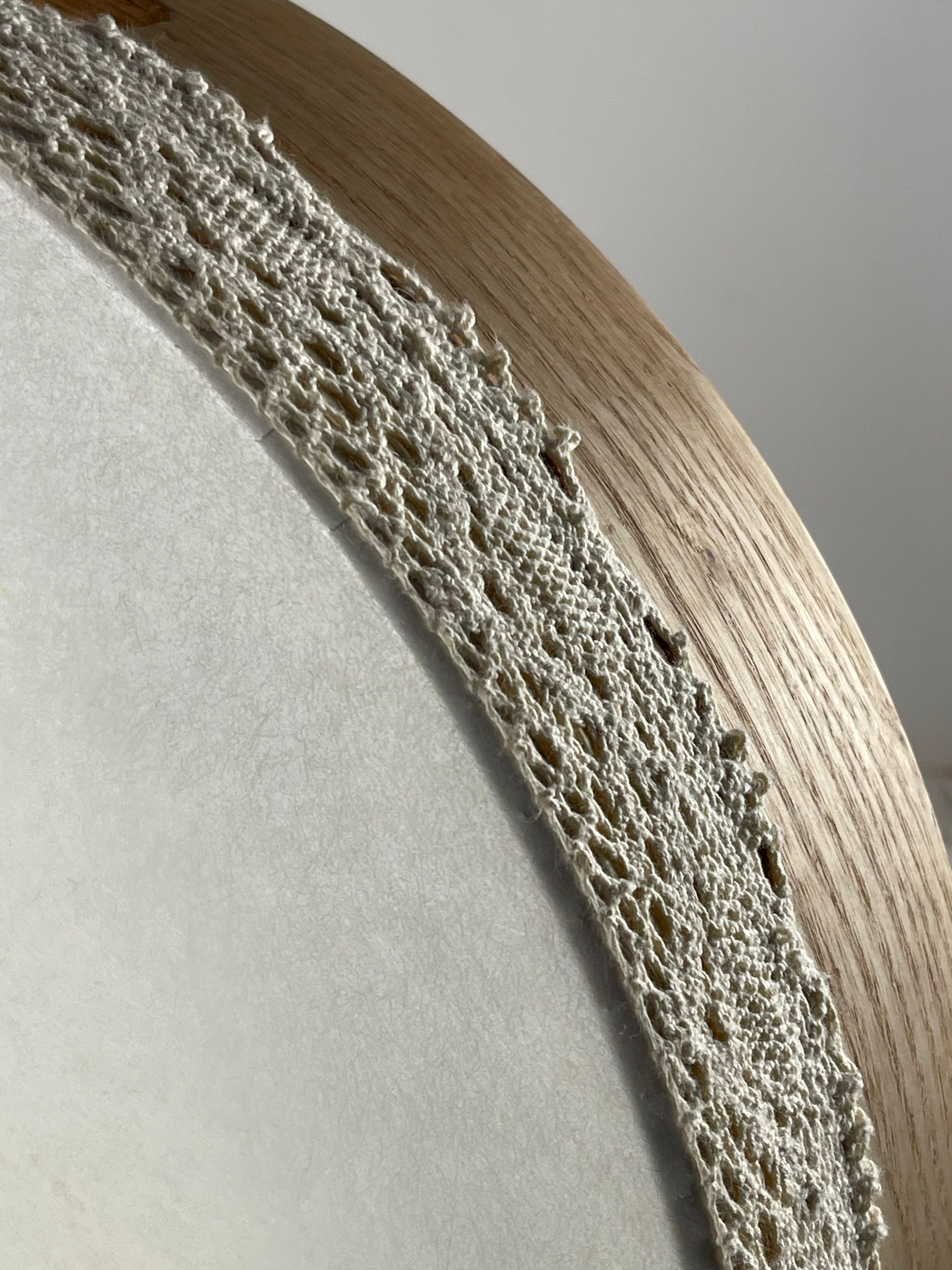 Top view of oak frame with white synthetic head