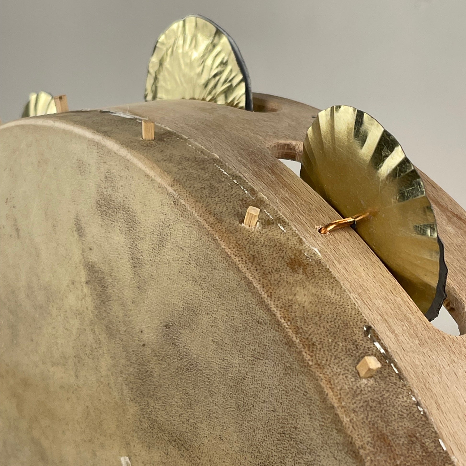 Traditional tambourine with brass jingles and goatskin head