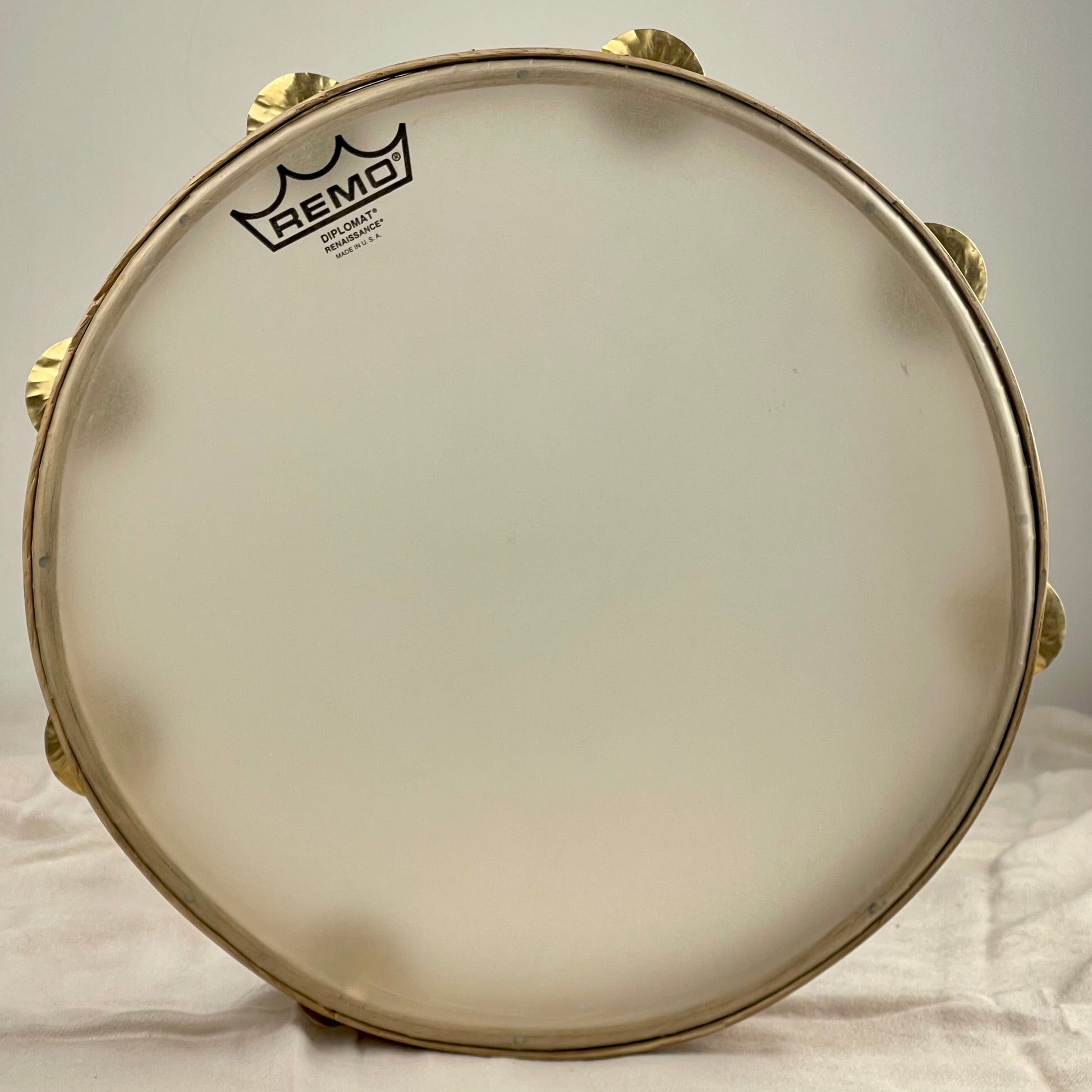 Tunable tambourine with 7 hammered brass jingles
