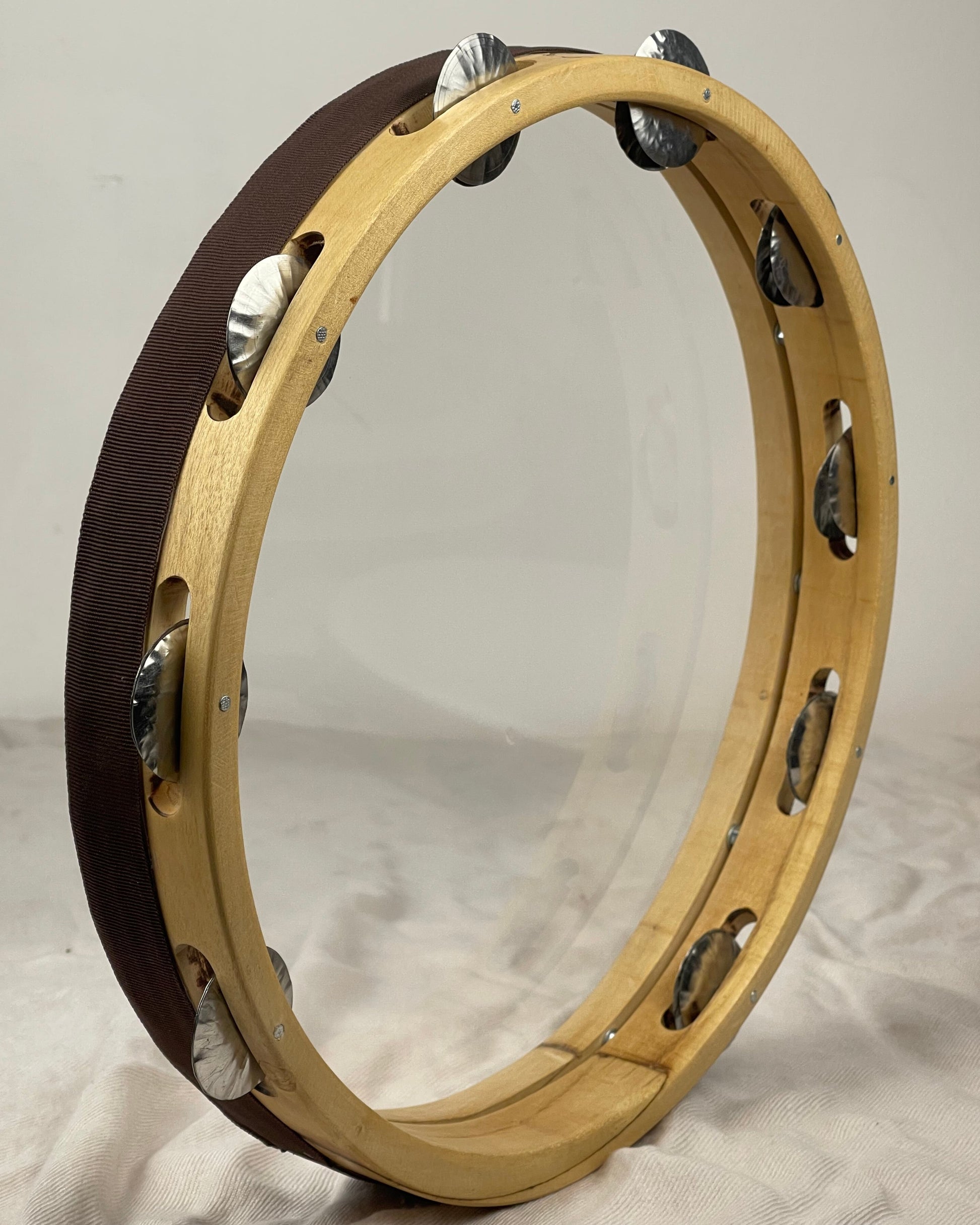 Tunable tambourine with 9 hand-hammered tin jingles