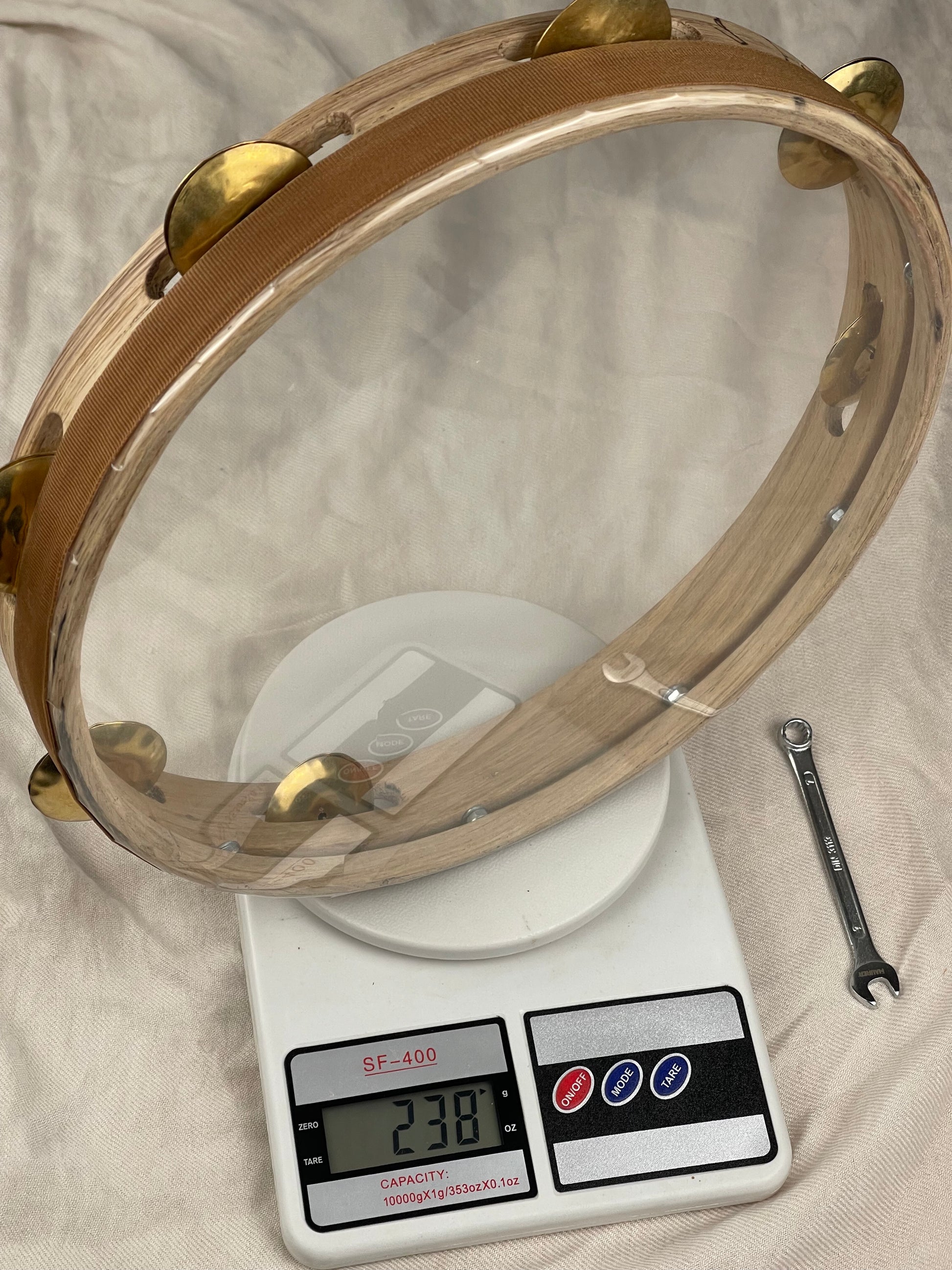 Side view of Maestrale tamburello showing low-profile 4.5 cm frame