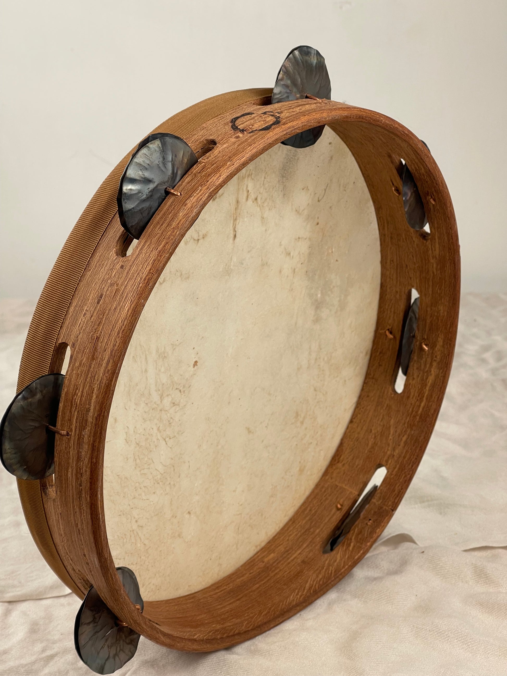 lose-up of hand-dyed red goatskin head on Calabrian tambourine