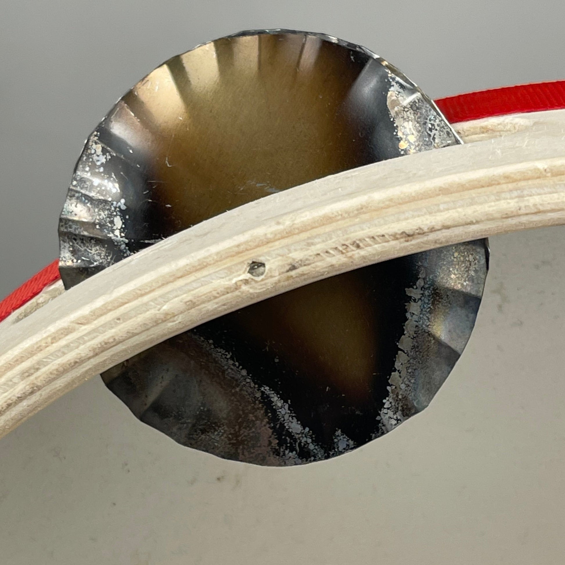 Close-up of hammered jingles on folk tambourine