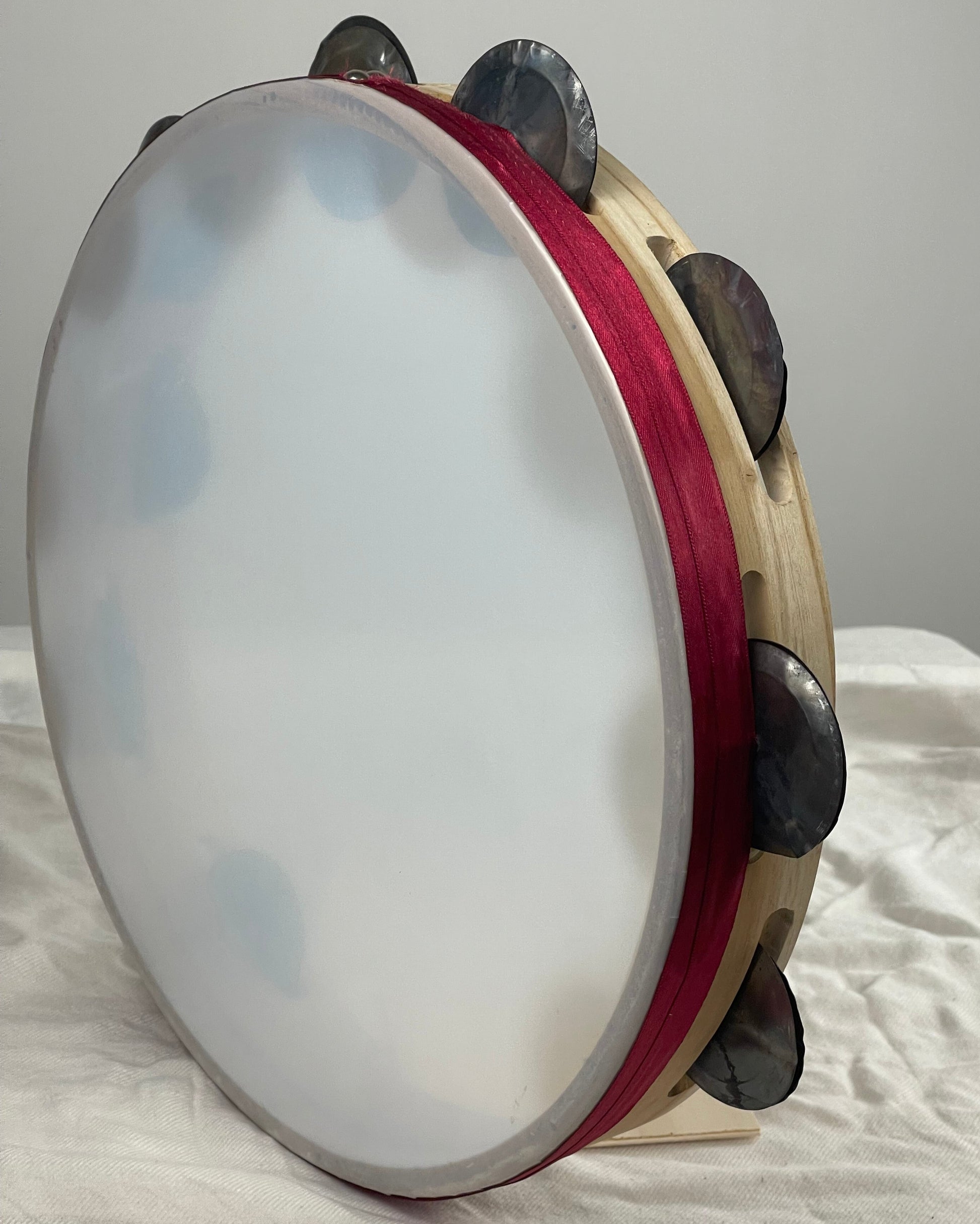 Hand-hammered jingles – semi-transparent tambourine